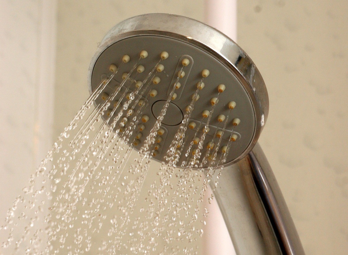 safe and easy to use walk in shower A close up of a running shower head